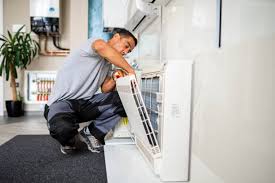 Air conditioning duct cleaning technician in St. Charles MO improving HVAC efficiency
